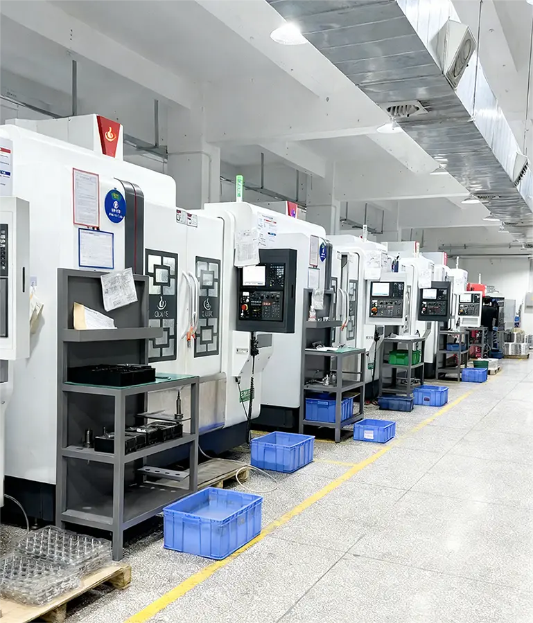 BW factory worker operating CNC machining centers for precision metal parts manufacturing